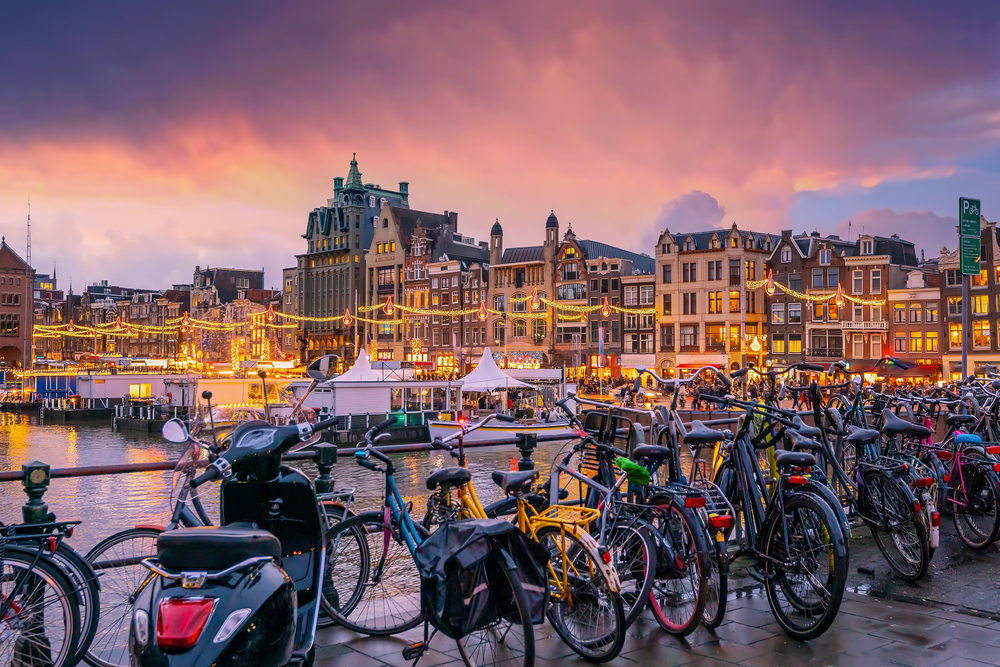 Downtown,Amsterdam,City,Skyline.,Cityscape,In,Netherlands,At,Sunset