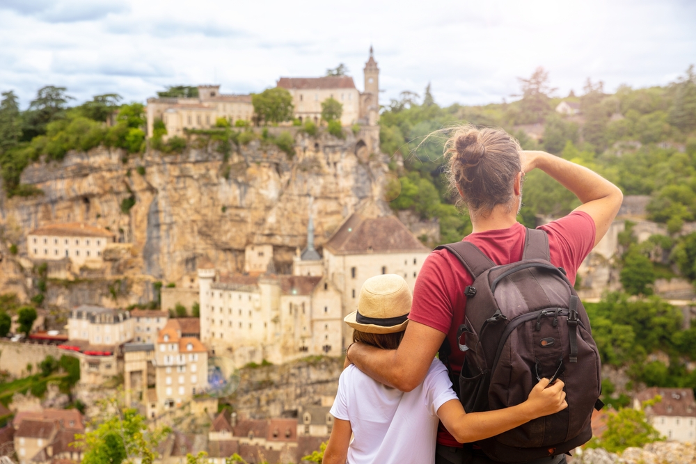 Children,And,Father,Looking,Panoramic,View,Of,Rocamadour ,France