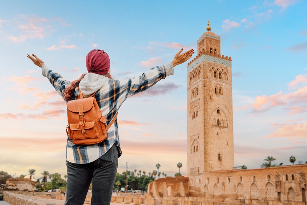 Young,Woman,Admiring,The,Stunning,Koutoubia,Mosque,In,Marrakech,,Morocco,